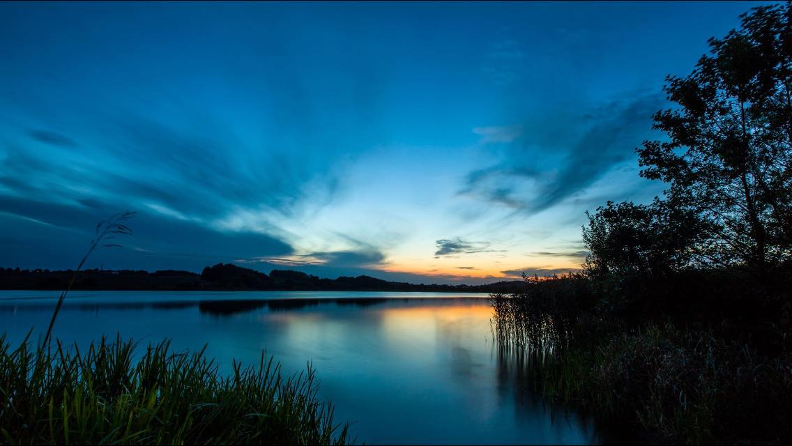 Solnedgang Over Ring Sø